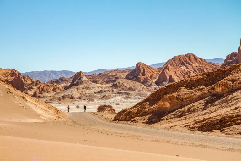 2 bikers on a dirt road in Atacama